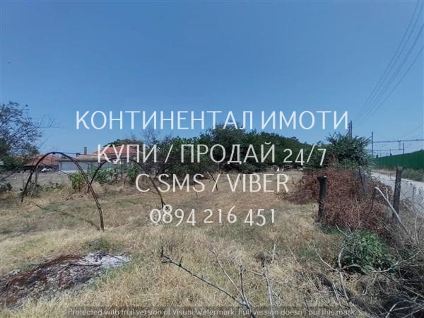 Код 70031. Парцел 720м2 до къщи, ток и вода с достъп по асфалтов път - идеален за жилщо застрояване. - снимка 1